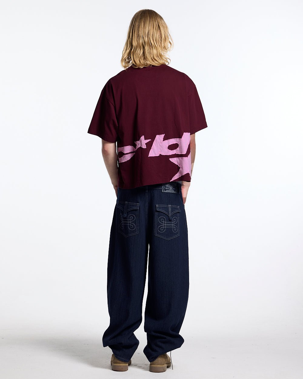 DISTRESS DEFENSE TEE BURGUNDY - burgundy graphic print tee, back view on male model - Cold Culture #man