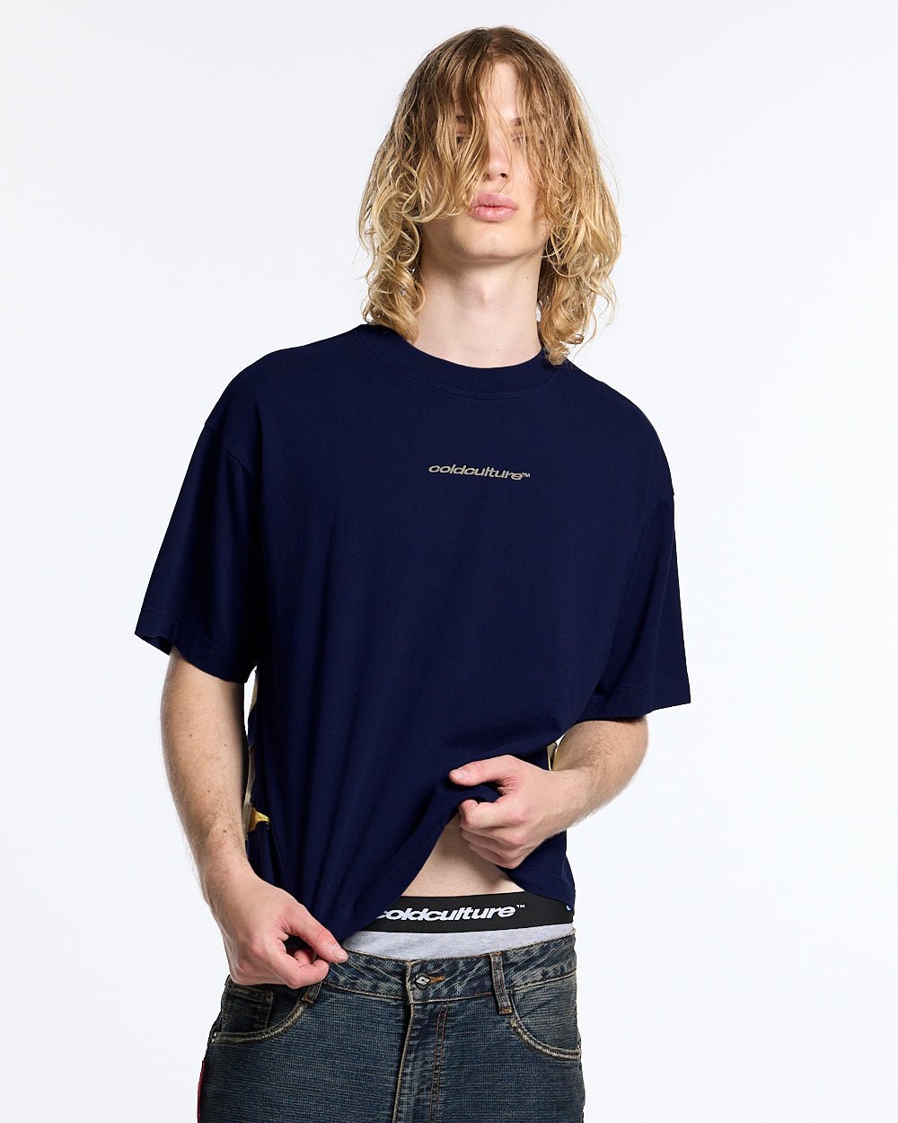 DISTRESS DEFENSE TEE NAVY - navy blue graphic print tee, front view on male model - Cold Culture #man