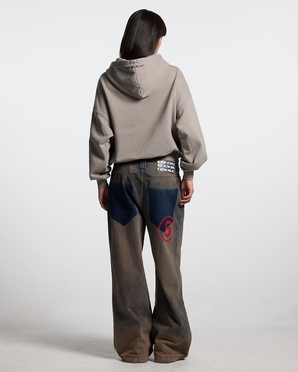 DISTRESS STARS HOODIE BEIGE - beige distressed hoodie, back view on female model - Cold Culture #woman