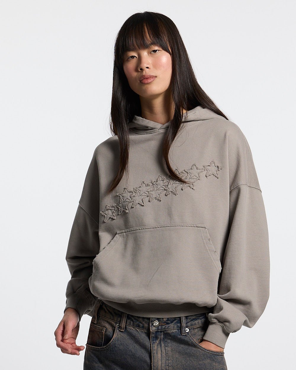 DISTRESS STARS HOODIE BEIGE - beige distressed hoodie, front view on female model - Cold Culture #woman