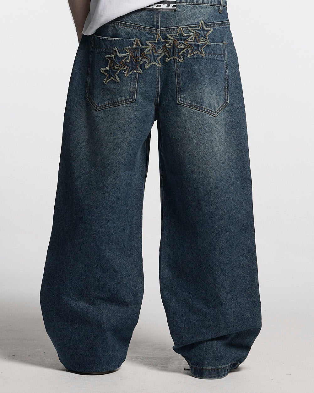 DISTRESS STARS V2 PANTS BLUE DENIM - blue washed denim pants, back view on male model - Cold Culture