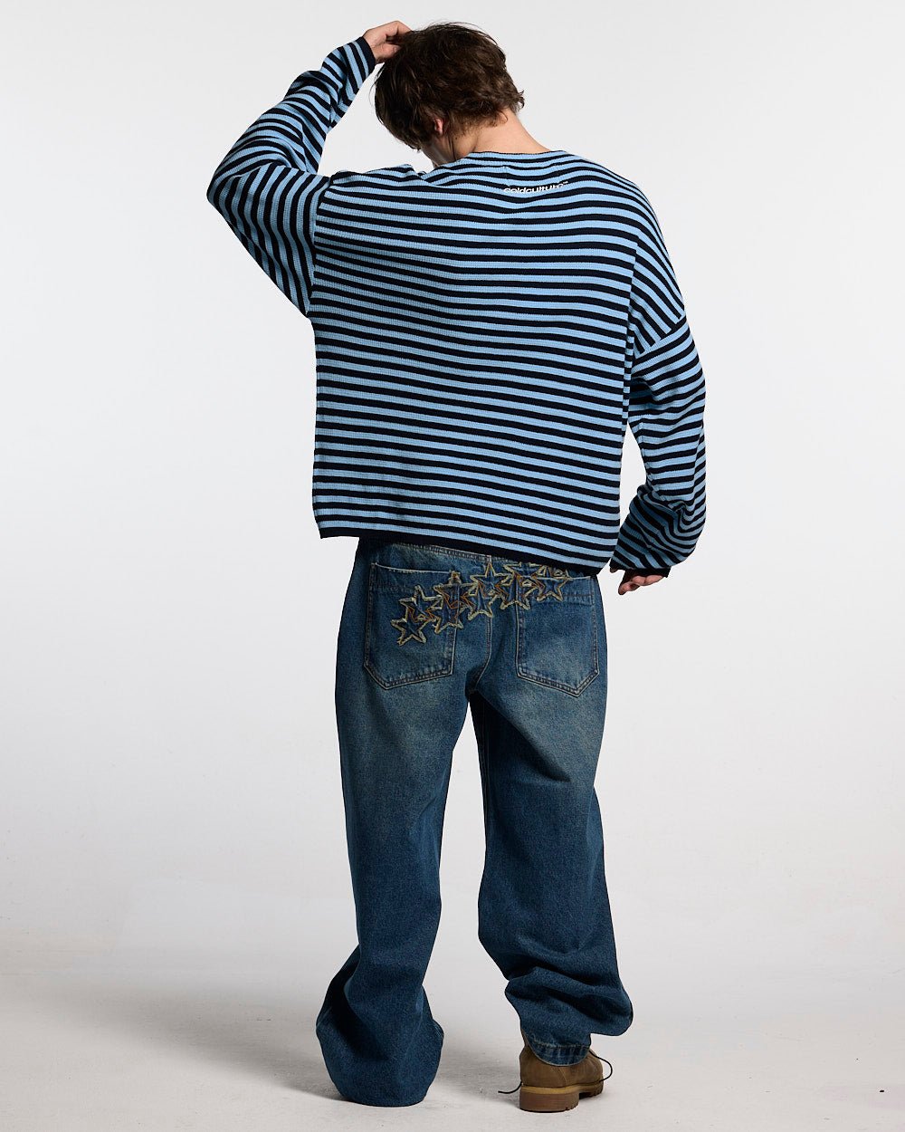 DISTRESS STARS V2 PANTS BLUE DENIM - blue washed denim pants, back view on male model - Cold Culture #man
