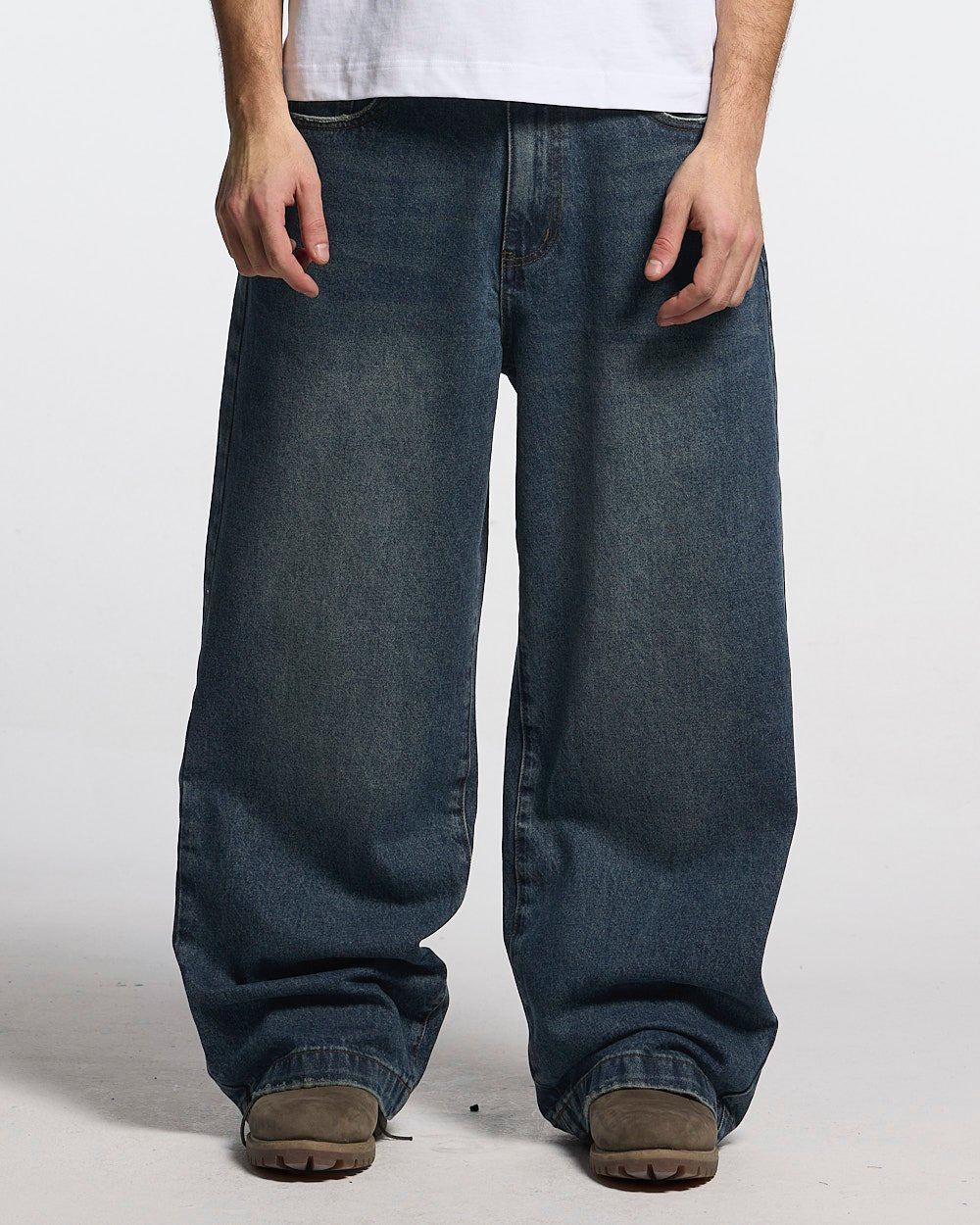 DISTRESS STARS V2 PANTS BLUE DENIM - blue washed denim pants, front view on male model - Cold Culture