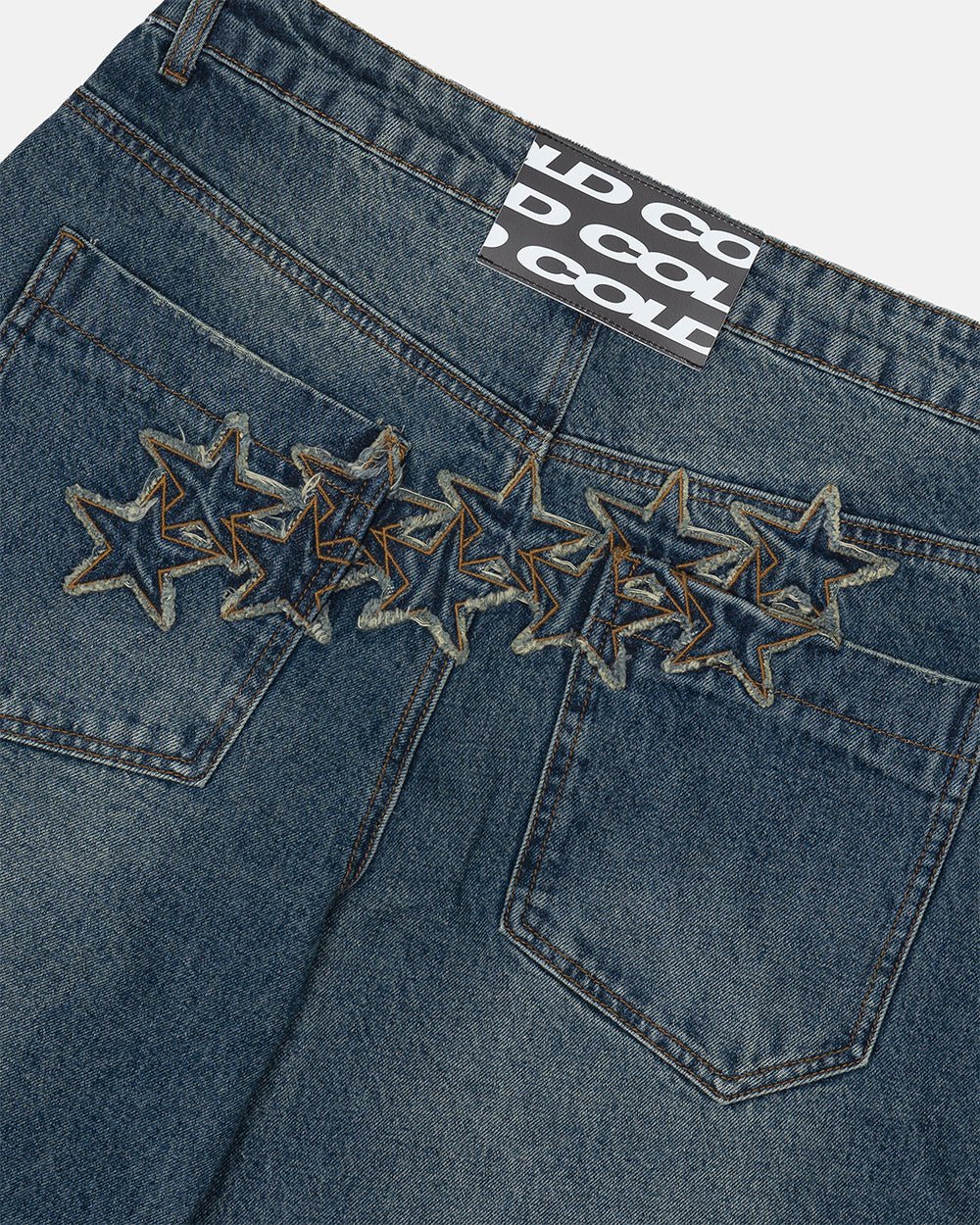 DISTRESS STARS V2 PANTS BLUE DENIM - blue washed denim pants, detail close-up - Cold Culture