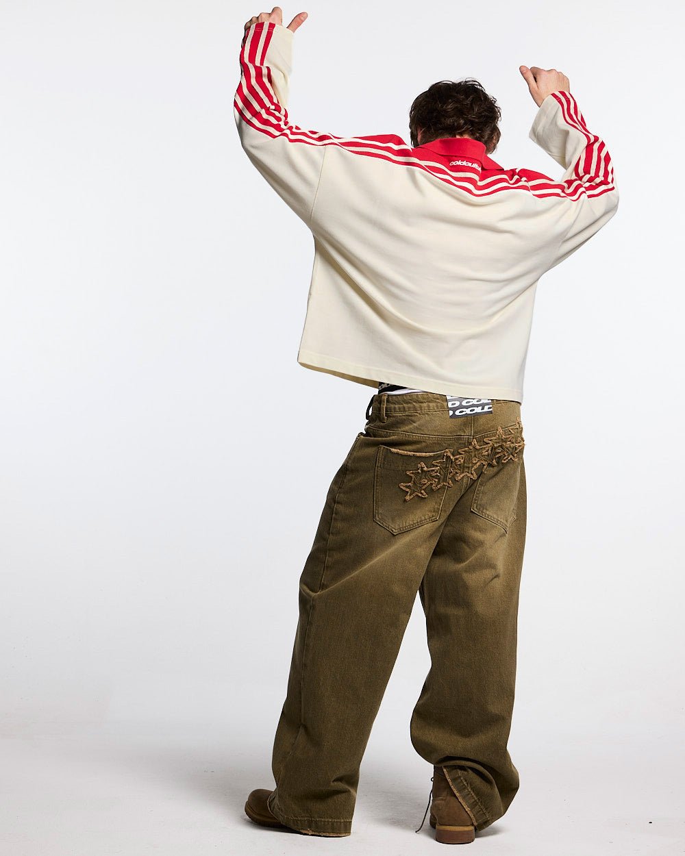 DISTRESS STARS V2 PANTS BROWN DENIM - brown washed denim pants, back view on male model - Cold Culture #man