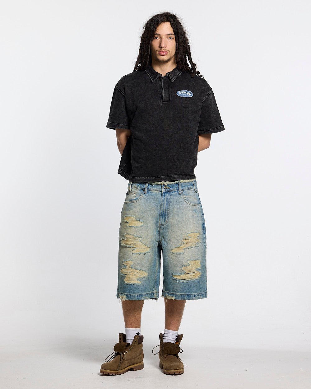 DISTRESSED DOLLAR POLO BLACK - black polo with denim applique, front view on male model - Cold Culture #man
