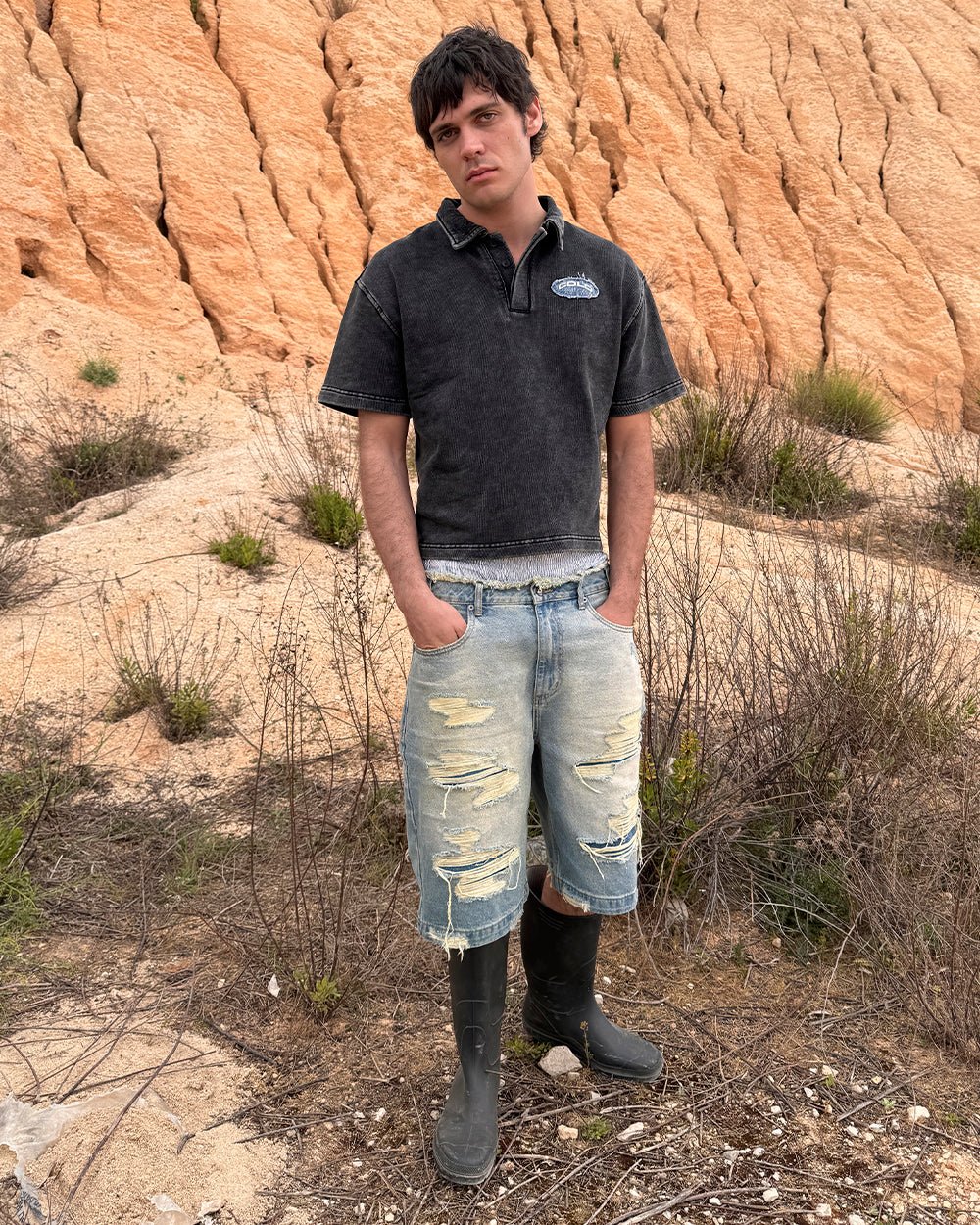 DISTRESSED DOLLAR POLO BLACK - black polo with denim applique, street style shot - Cold Culture