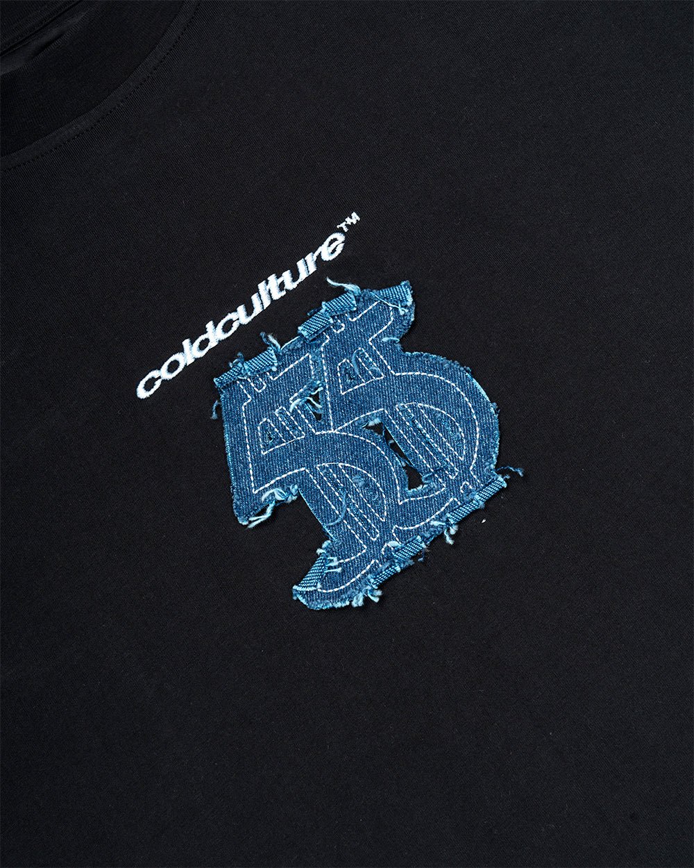 DISTRESSED DOLLAR TEE BLACK - black tee with denim applique, detail close-up - Cold Culture