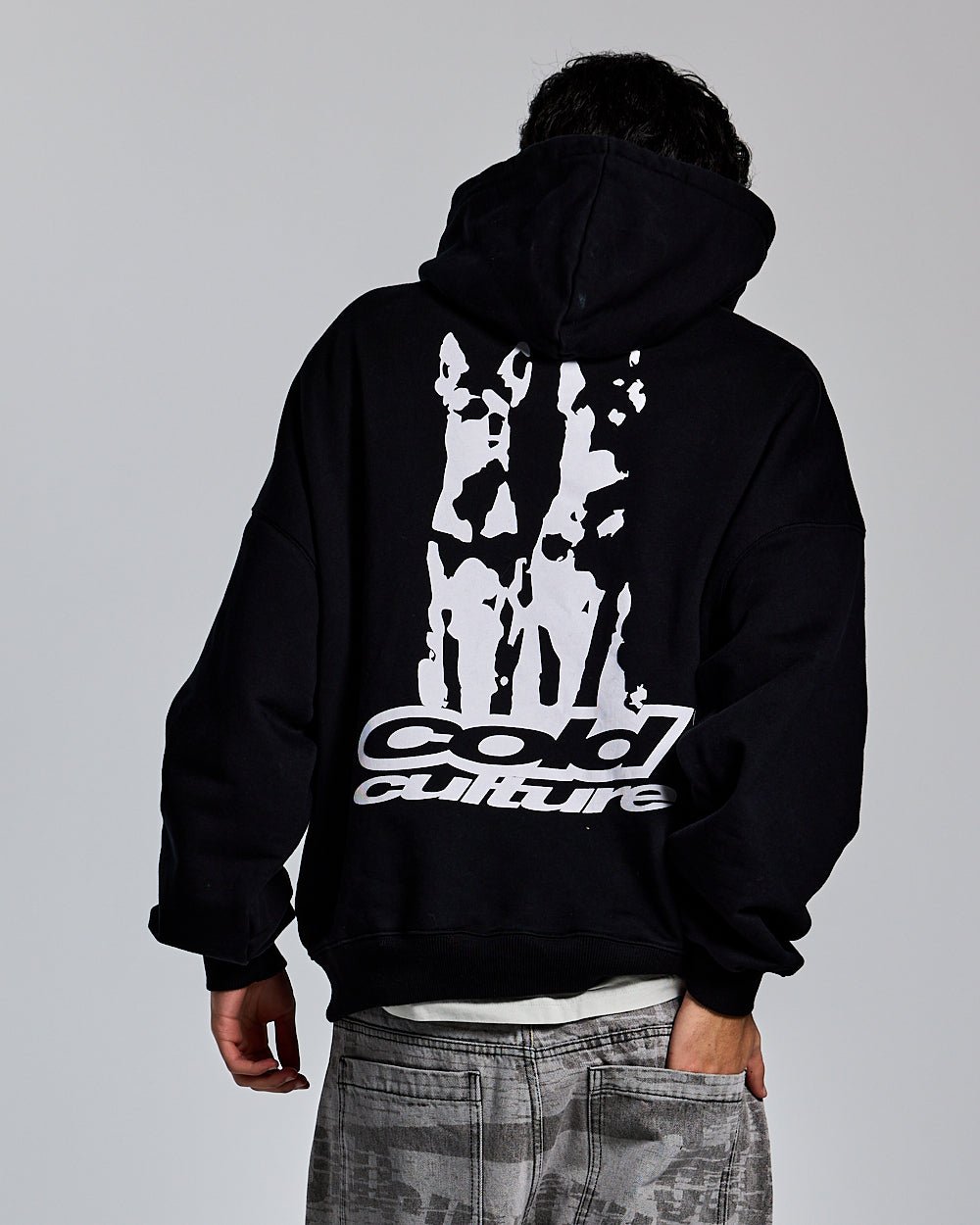 DOGS HOODIE BLACK - black graphic print hoodie, back view on male model - Cold Culture