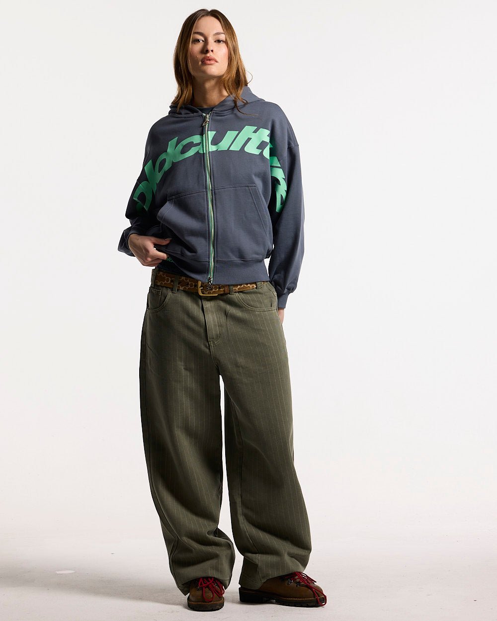 DRIVEN ZIP HOODIE INDIGO BLUE - indigo blue zip-up hoodie, front view on female model - Cold Culture #woman