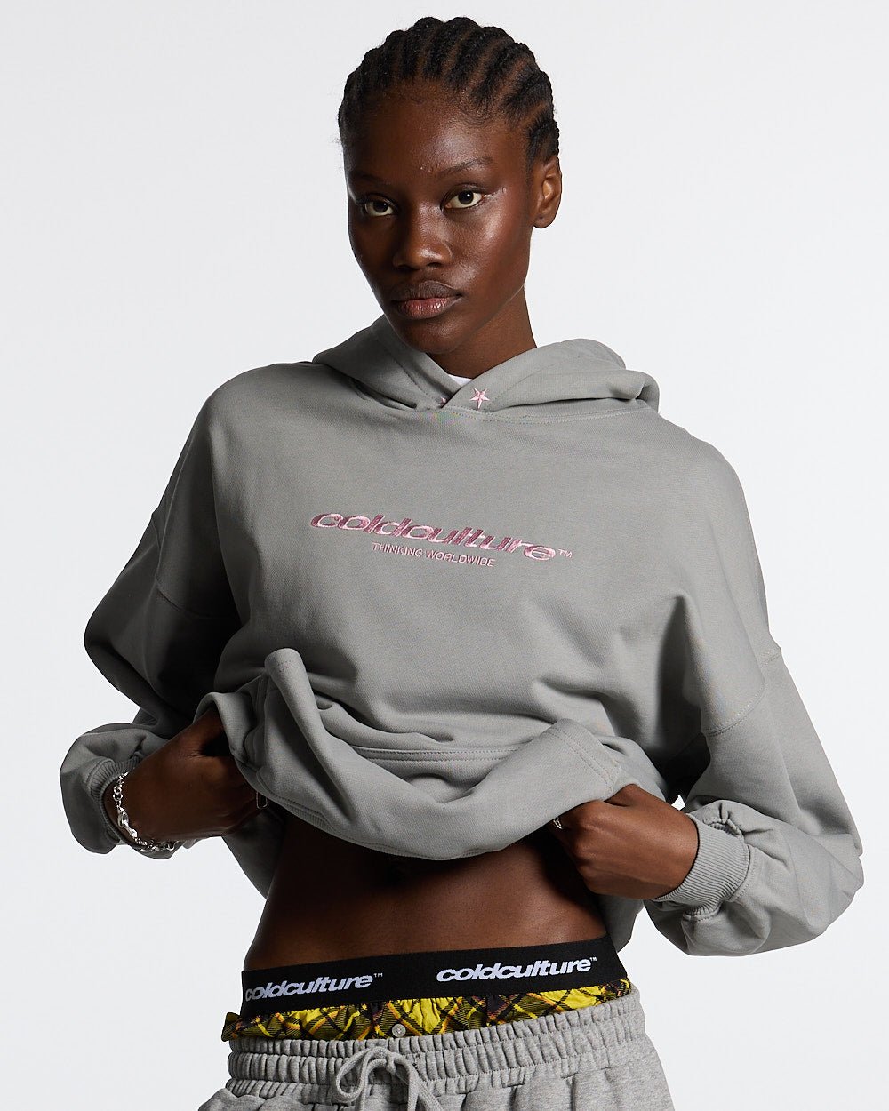 ESSENTIAL HOODIE ULTIMATE GREY - light grey oversized hoodie, front view on female model - Cold Culture #woman