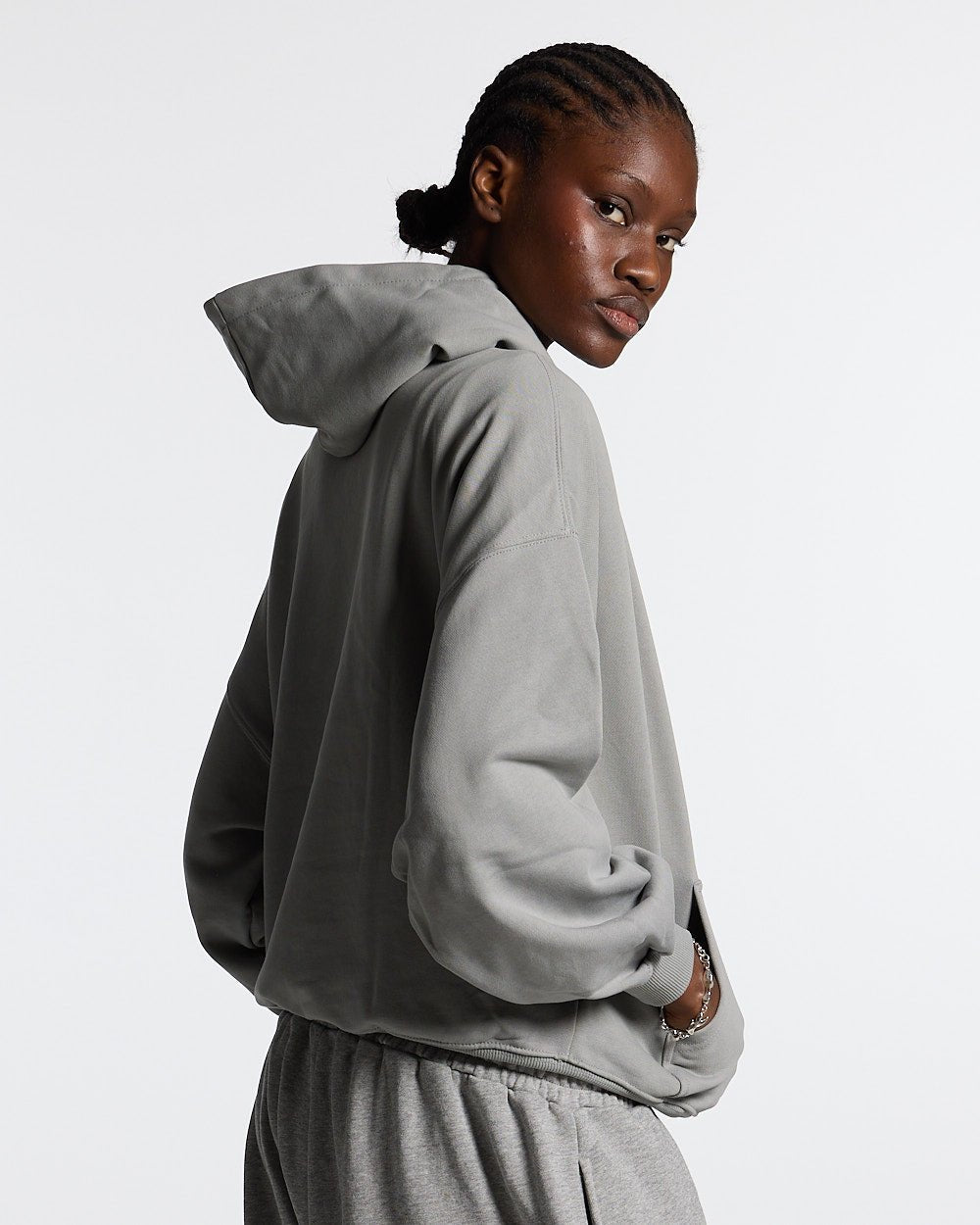 ESSENTIAL HOODIE ULTIMATE GREY - light grey oversized hoodie, back view on female model - Cold Culture #woman