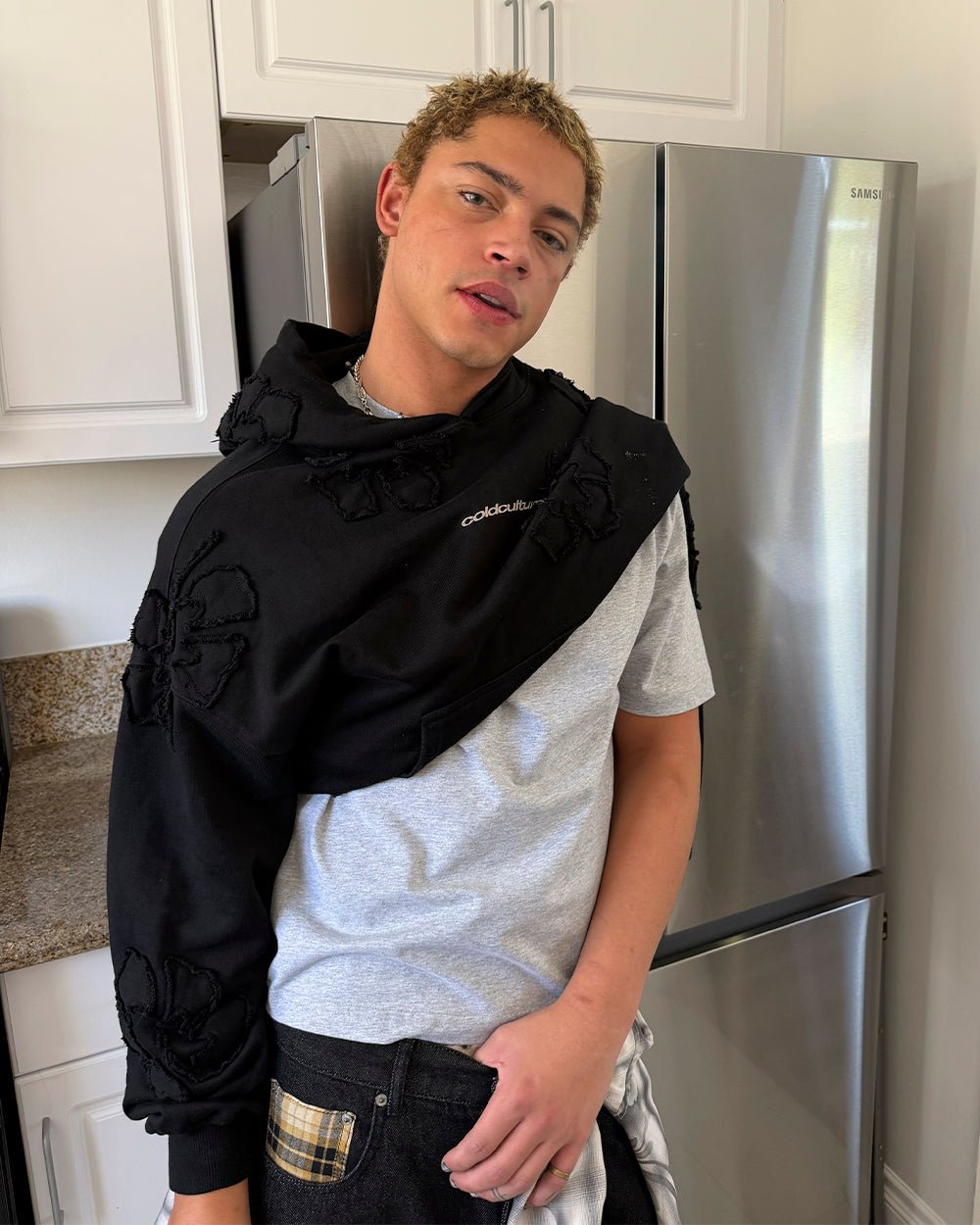 FAKE LOVE HOODIE BLACK - black floral applique hoodie, street style shot - Cold Culture