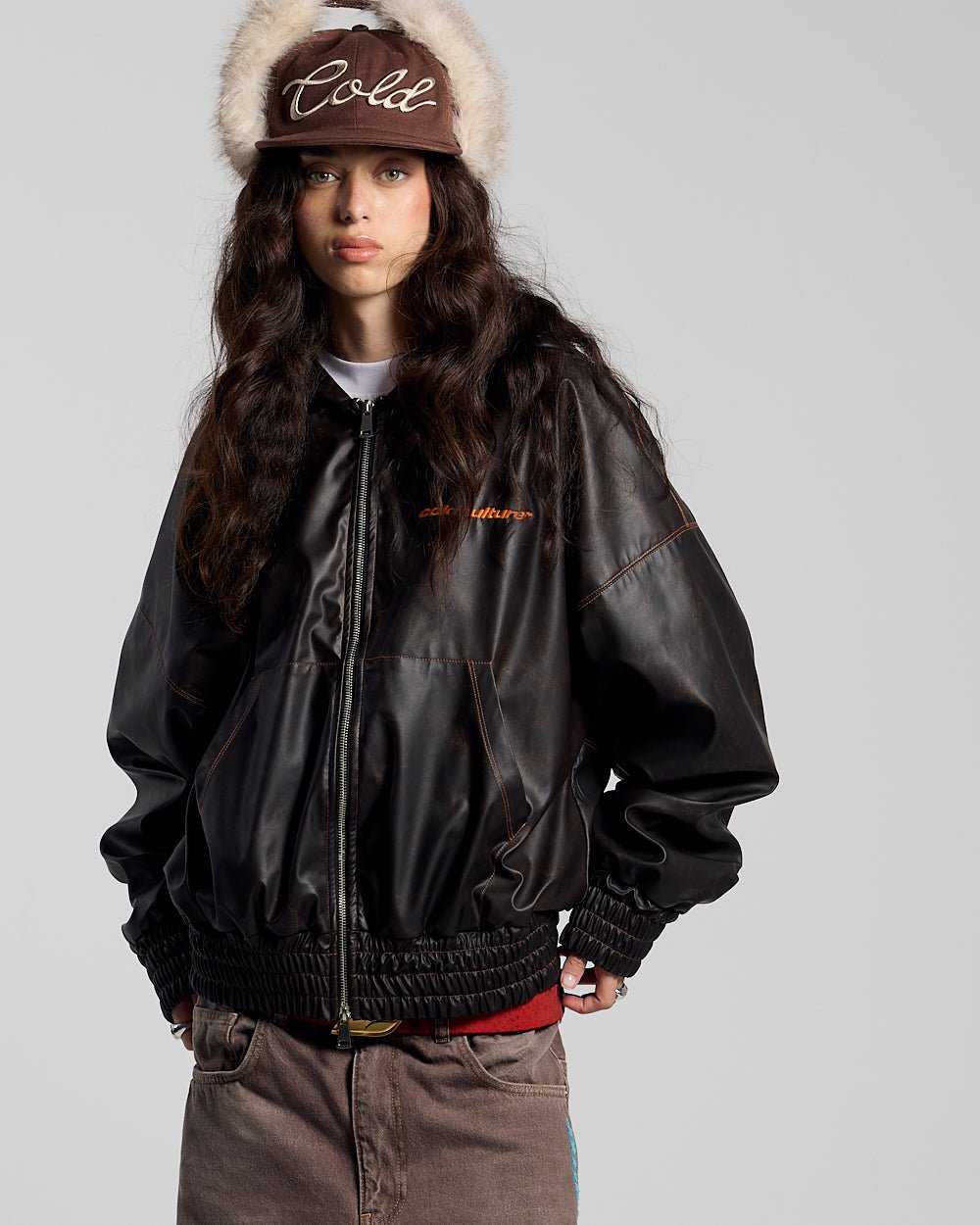 FAUX LEATHER ZIP HOODIE BROWN - brown faux leather hooded jacket, front view on female model - Cold Culture #woman