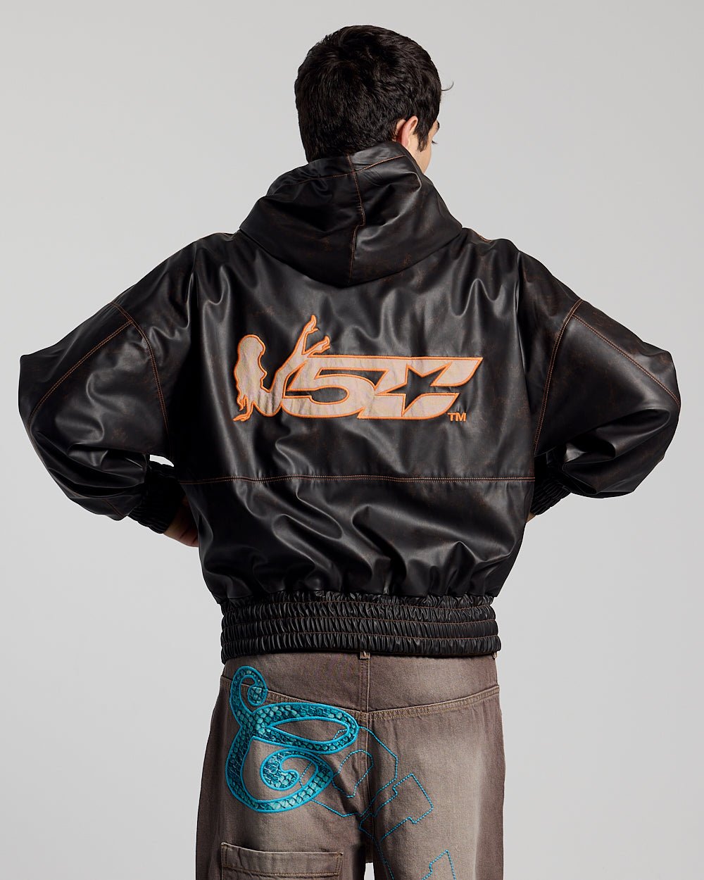 FAUX LEATHER ZIP HOODIE BROWN - brown faux leather hooded jacket, back view on male model - Cold Culture