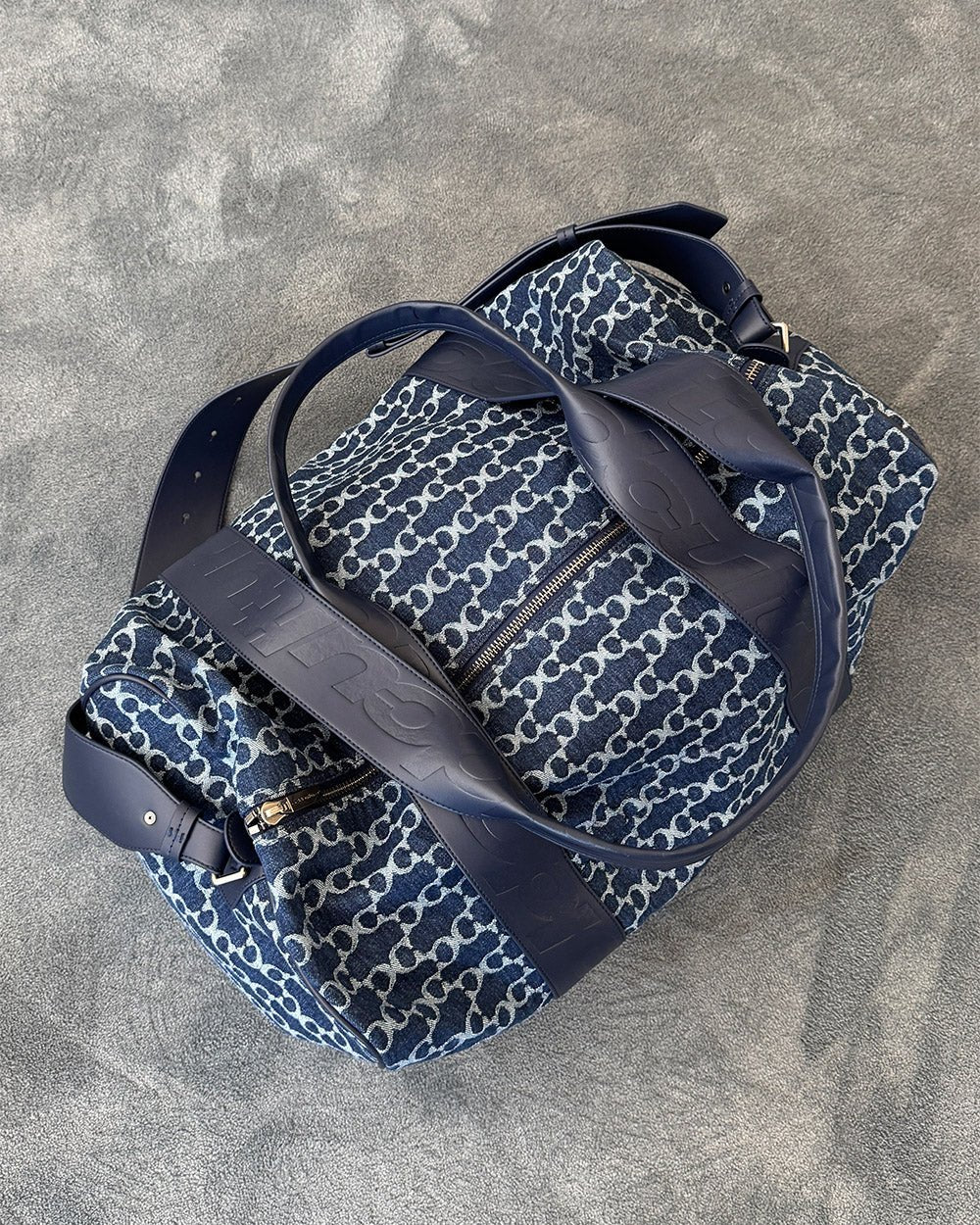 FEVER BAG BLUE - blue monogram duffle bag, flat lay - Cold Culture