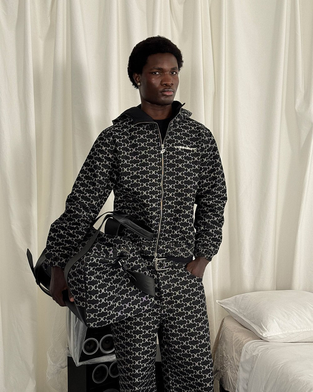 FEVER JACKET BLACK - black monogram hooded jacket, front view on male model - Cold Culture