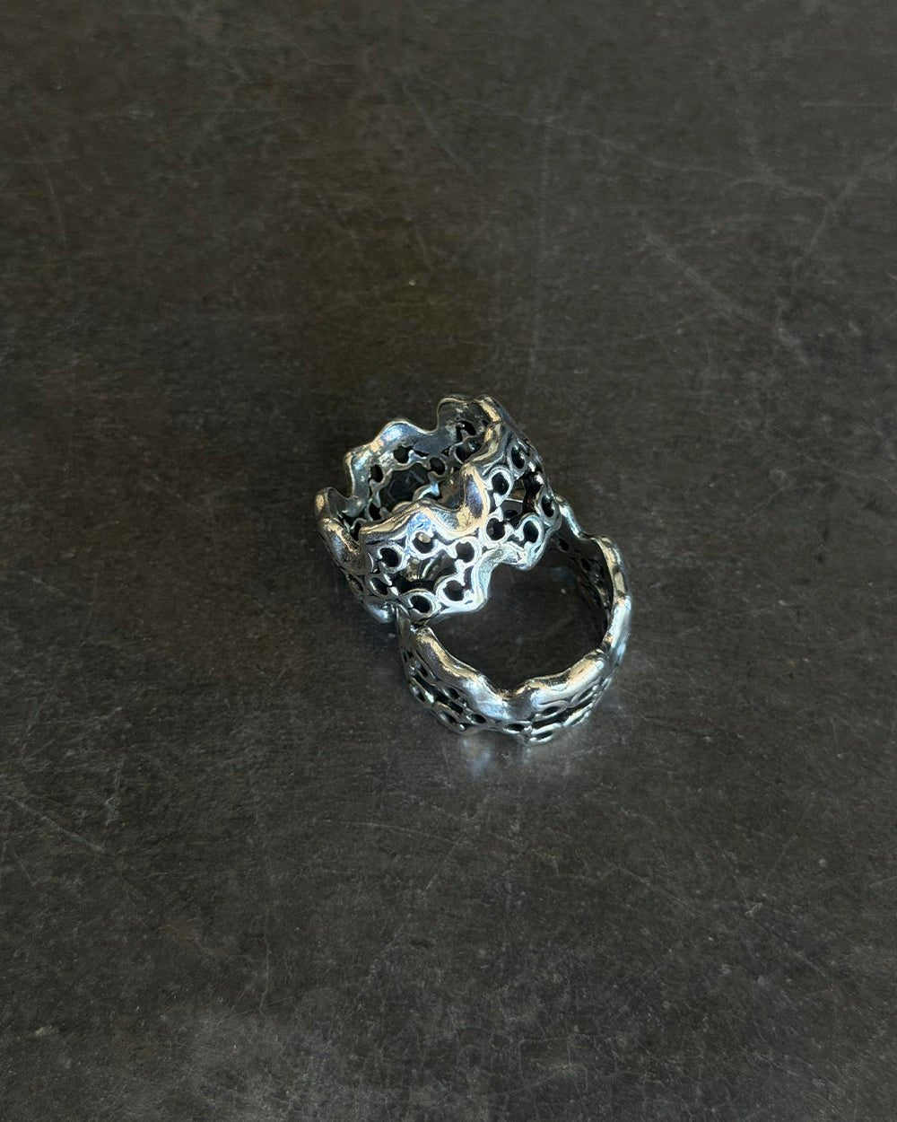 FEVER RING SILVER - silver openwork band ring, flat lay - Cold Culture