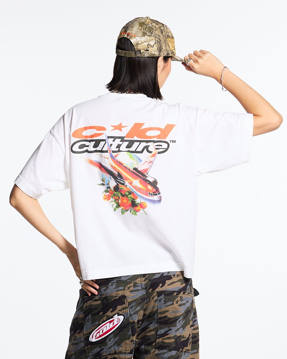 FLIGHT PATH TEE WHITE - white graphic print tee, back view on female model - Cold Culture #woman