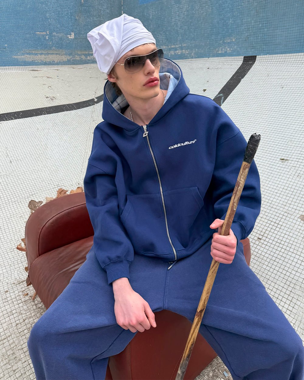 HIDE AND SEEK ZIP HOODIE NAVY - navy zip-up hoodie, street style shot - Cold Culture #woman