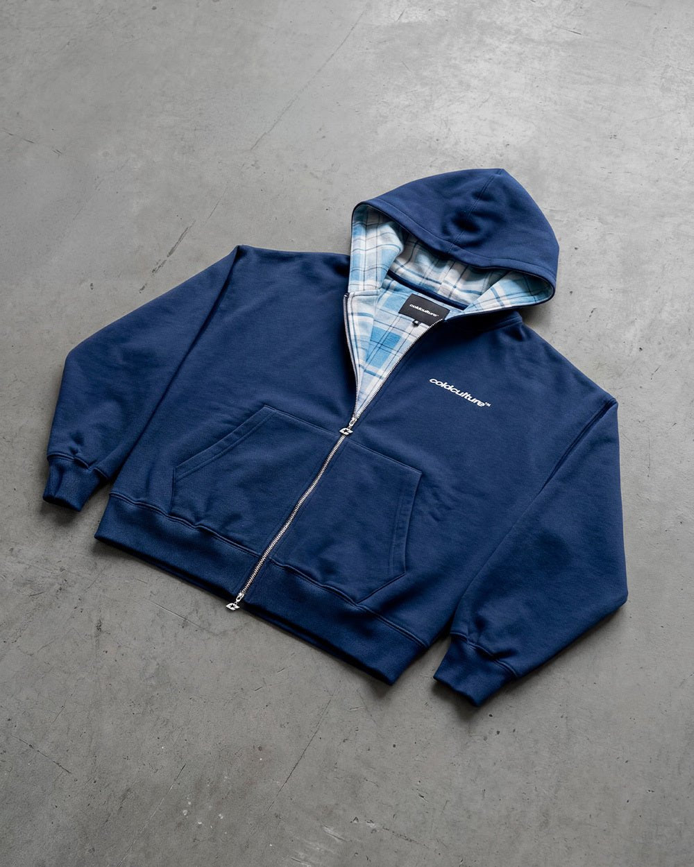 HIDE AND SEEK ZIP HOODIE NAVY - navy zip-up hoodie, flat lay - Cold Culture