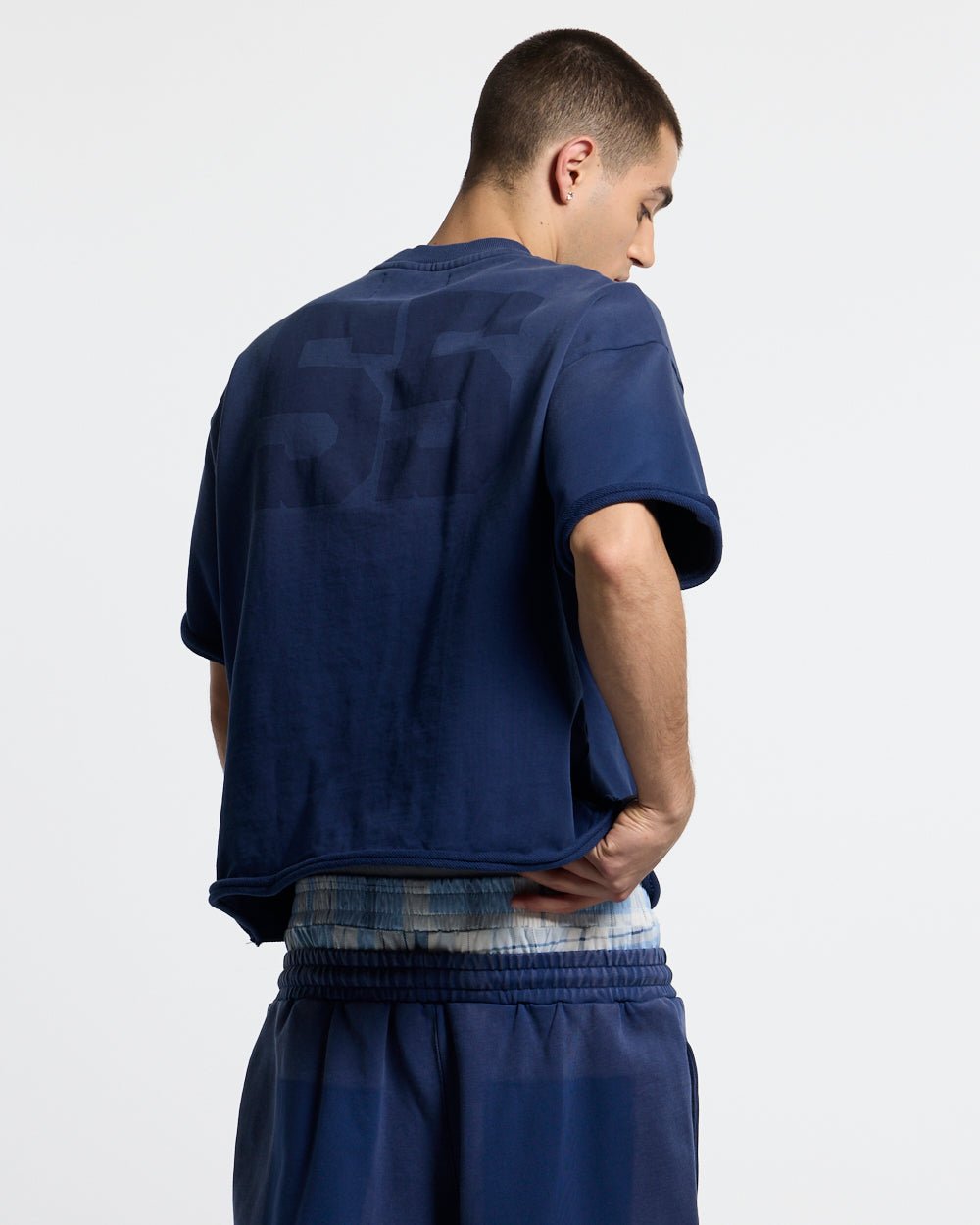 HIDE & SEEK TEE NAVY - navy oversized tee, back view on male model - Cold Culture #man