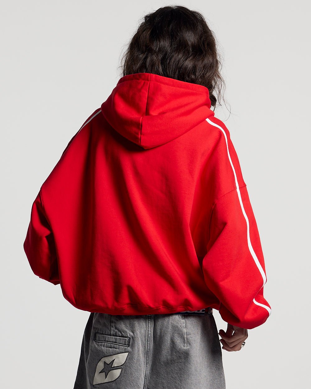 HIT THE TARGET HOODIE RED - red graphic print hoodie, back view on female model - Cold Culture #woman
