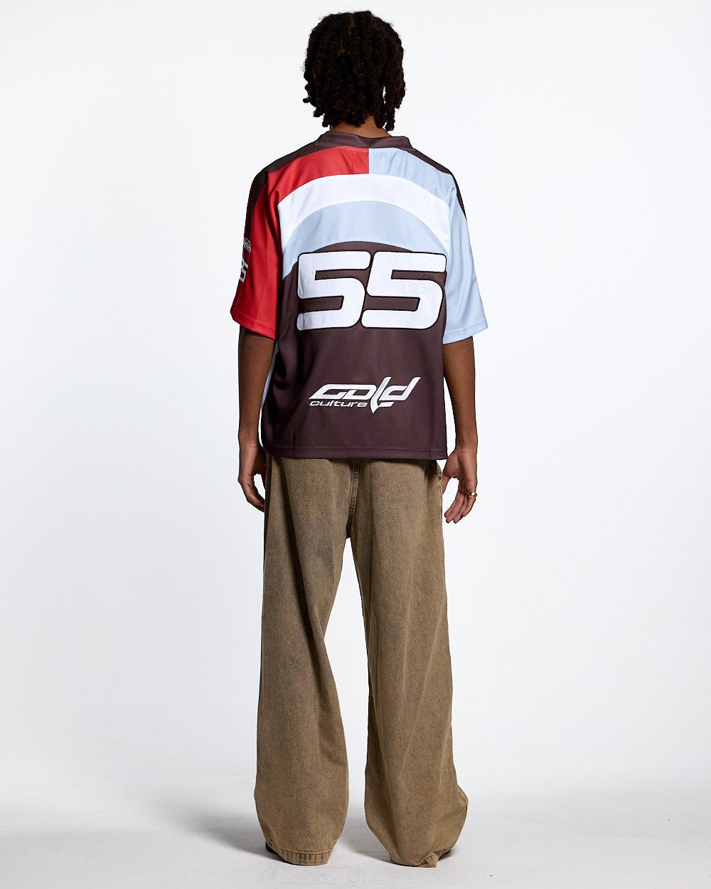 HOCKEY PLAYER TEE BROWN/ORANGE RED - brown and red graphic print tee, back view on male model - Cold Culture #man