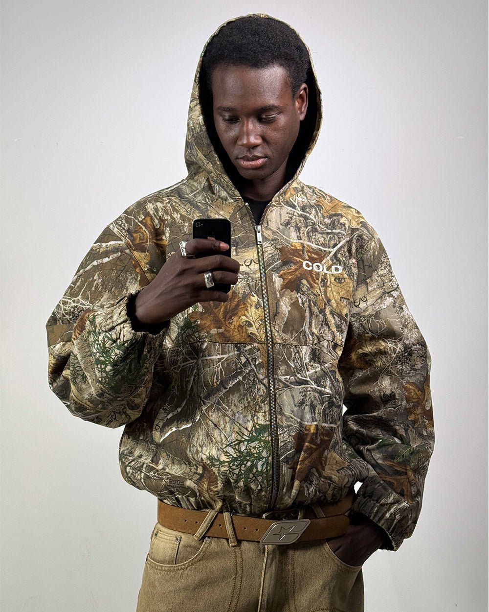 HOODED JACKET REALTREE - realtree camo hooded jacket, front view on male model - Cold Culture