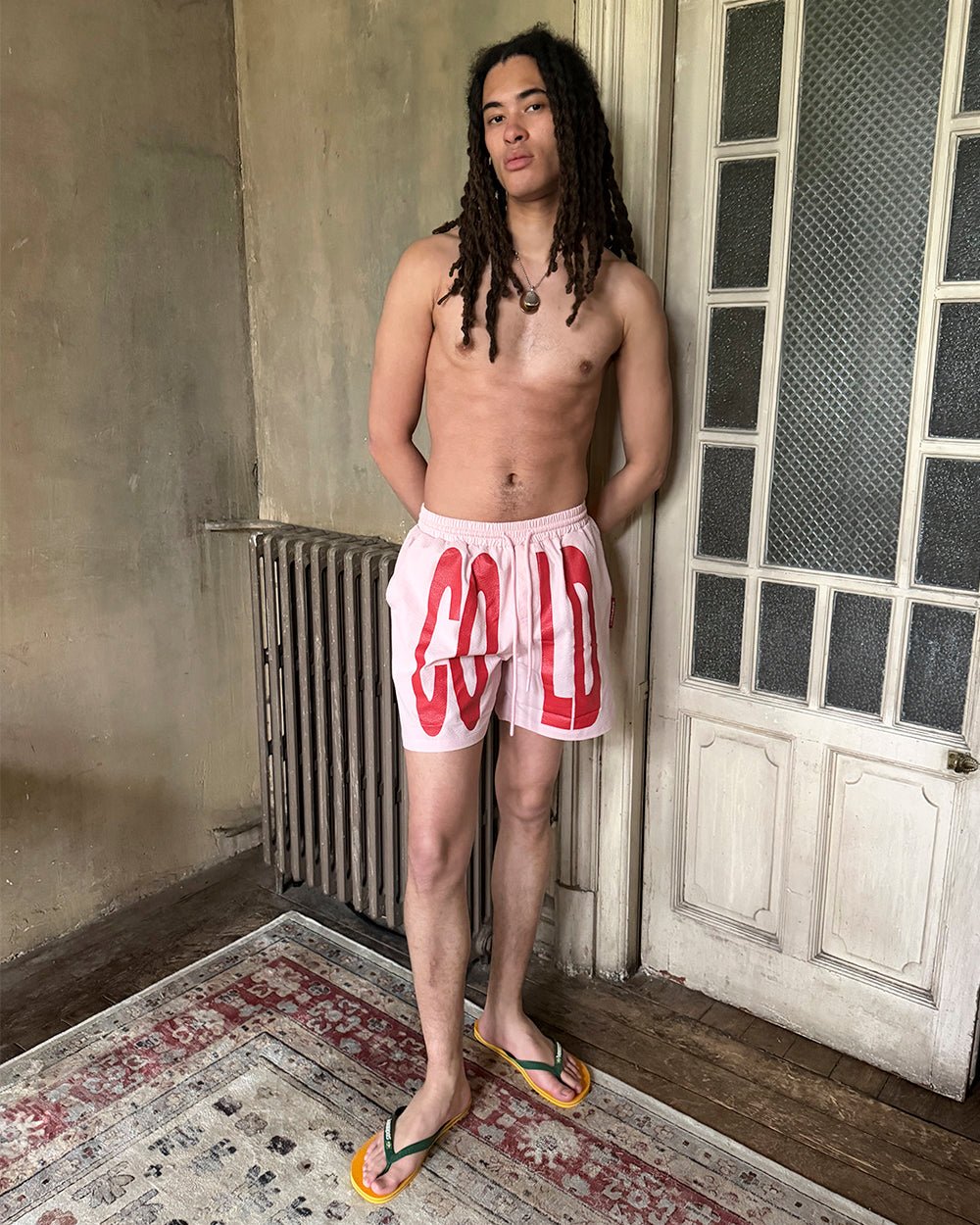 IMPACT SWIMWEAR PINK - pink printed swim shorts, street style shot - Cold Culture