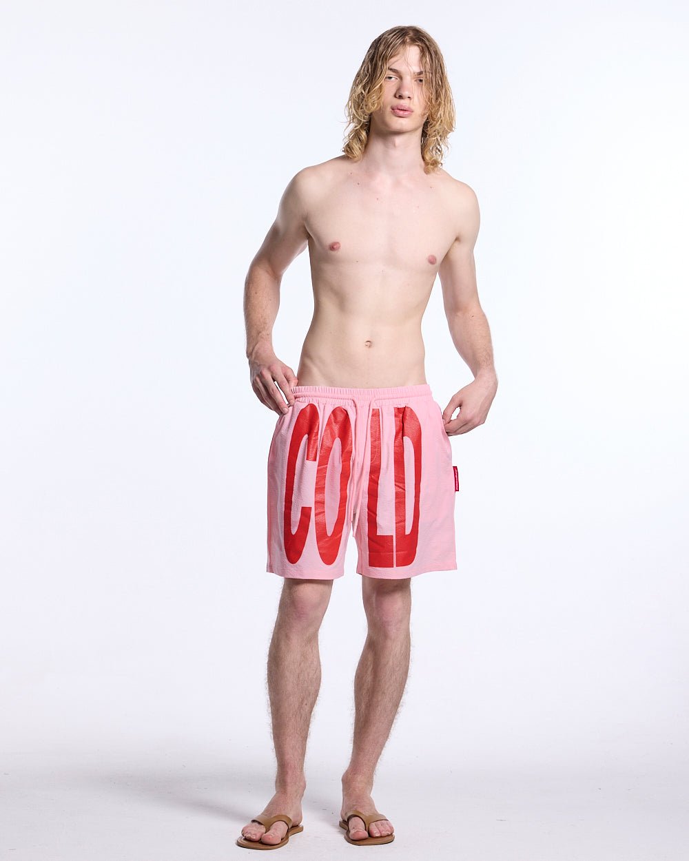 IMPACT SWIMWEAR PINK - pink printed swim shorts, front view on male model - Cold Culture #man