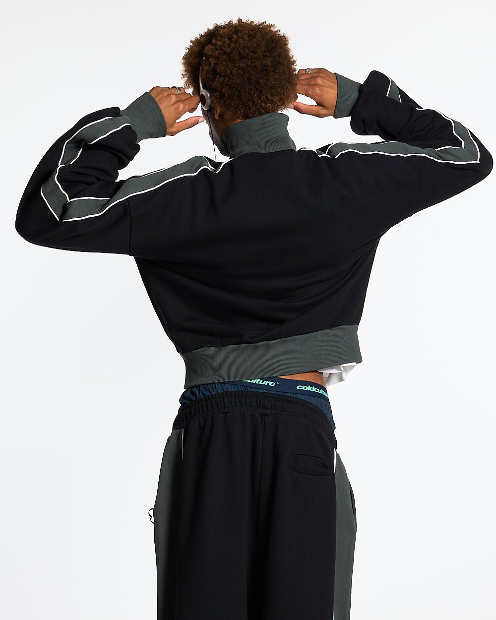 JET LAG JACKET BLACK - black and green zip-up hoodie, back view on male model - Cold Culture #man