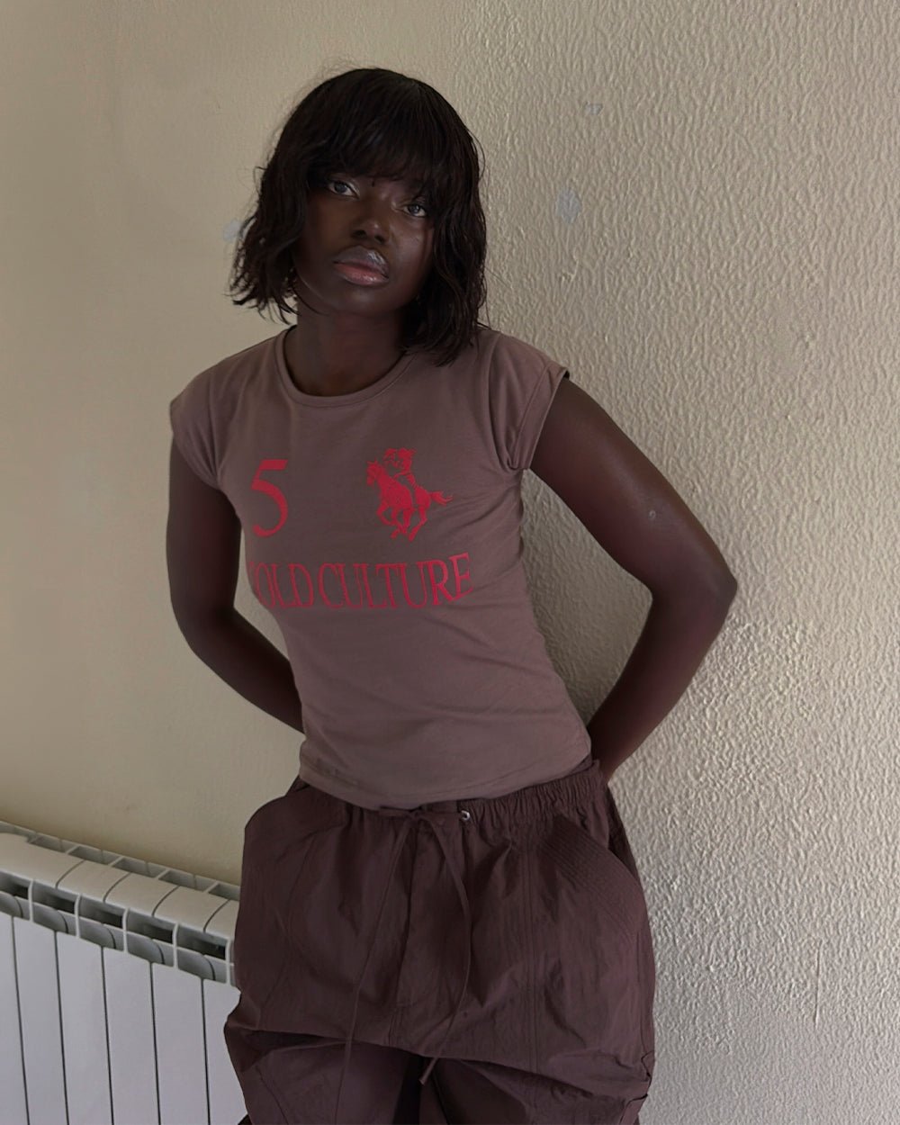 KNOTTY BABY TEE BROWN - brown graphic print baby tee, front view on female model - Cold Culture #woman