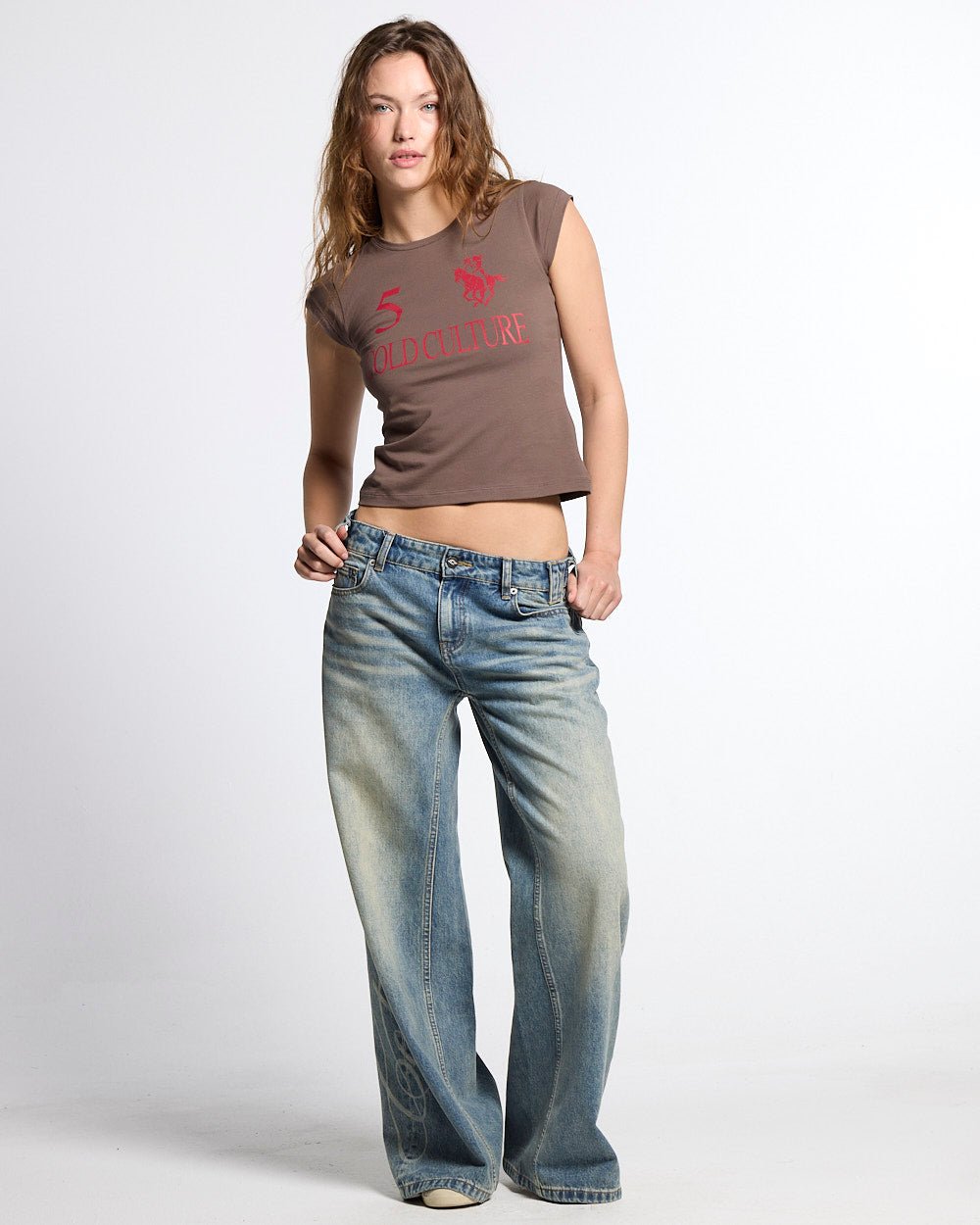 KNOTTY BABY TEE BROWN - brown graphic print baby tee, front view on female model - Cold Culture #woman