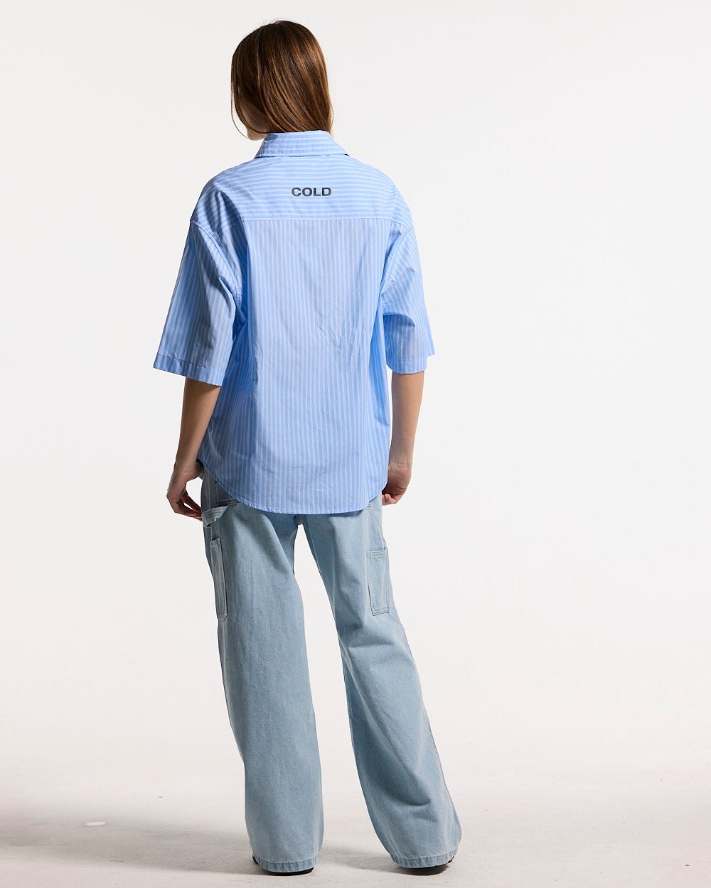 LEGACY SHIRT BLUE - blue striped short sleeve shirt, back view on female model - Cold Culture #woman