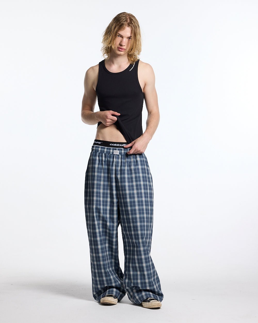 LIAR PANTS BLUE - blue plaid women's sweatpants, front view on male model - Cold Culture #man