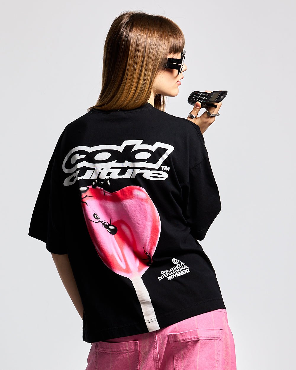 LOLLIPOP TEE BLACK - black graphic print tee, back view on female model - Cold Culture #woman