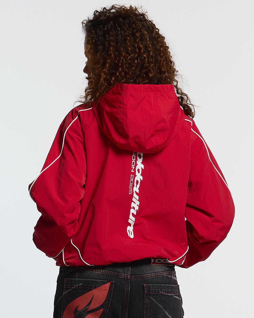 LONDON SET JACKET RED - red hooded track jacket, back view on female model - Cold Culture #woman