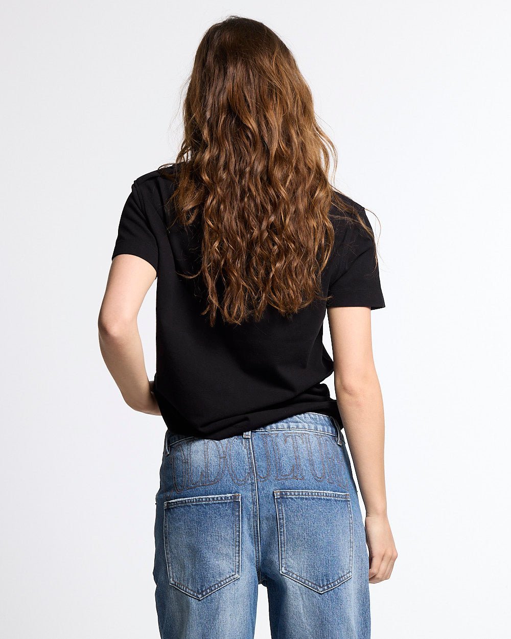 LOOPING POLO BLACK - black graphic print polo shirt, back view on female model - Cold Culture #woman