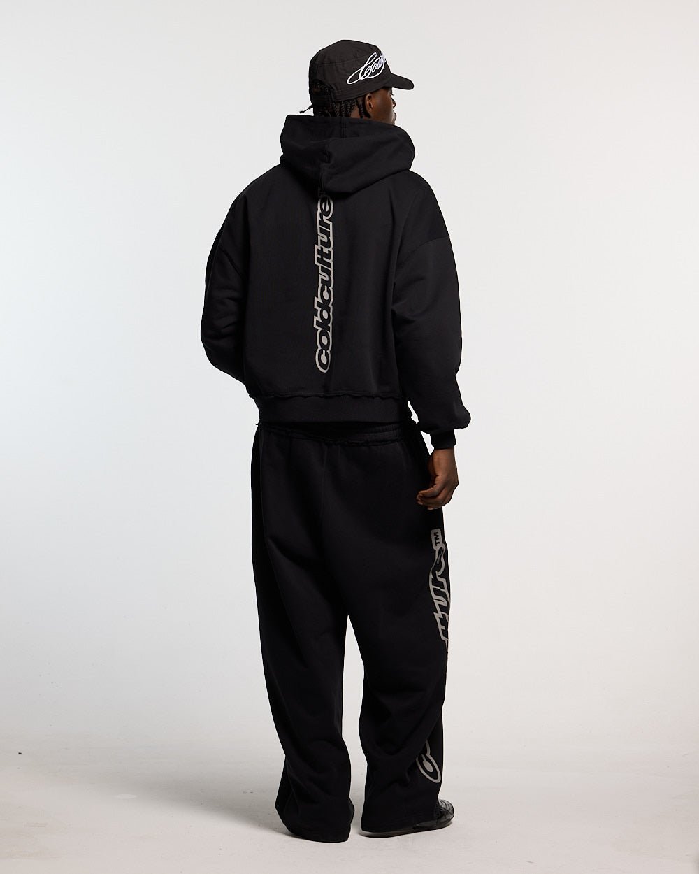 MIDNIGHT SET ZIP UP BLACK - black zip-up hoodie, back view on male model - Cold Culture