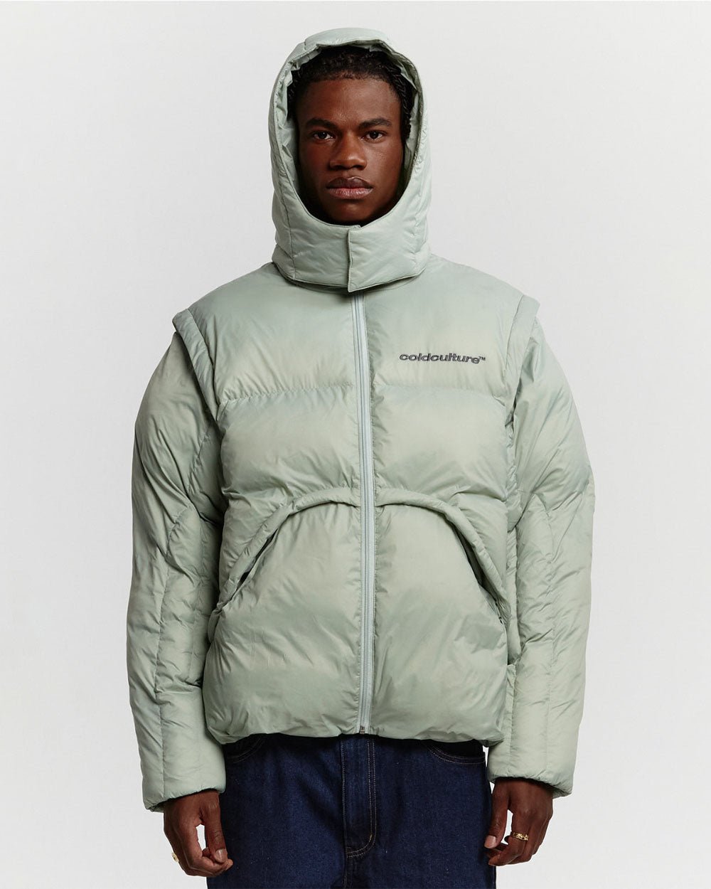 MULTIFUNCTIONAL PUFFER JACKET PISTACHIO GREEN - pistachio green hooded puffer jacket, front view on male model - Cold Culture #man