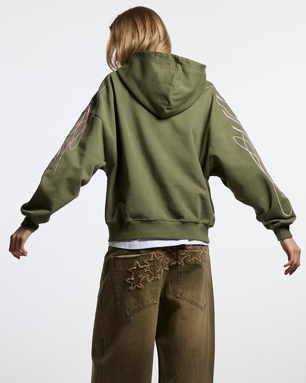 NEW SCRIPT ZIP HOODIE GREEN & PINK - olive green zip-up hoodie, back view on female model - Cold Culture #woman