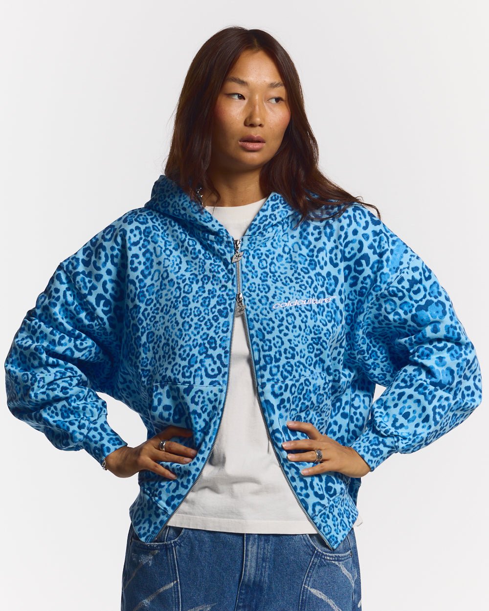 NOCTURNE BEAST ZIP HOODIE BLUE - blue leopard print zip-up hoodie, front view on female model - Cold Culture #woman