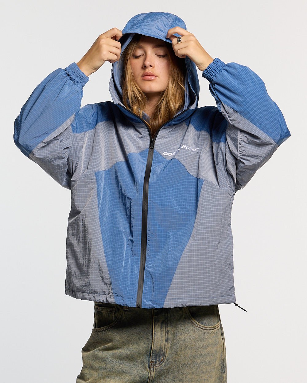 NOT FORMAL JACKET BLUE - blue colorblock hooded jacket, front view on female model - Cold Culture #woman