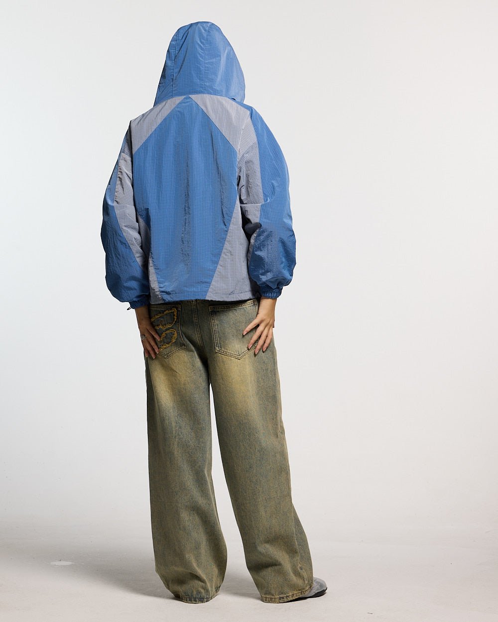 NOT FORMAL JACKET BLUE - blue colorblock hooded jacket, back view on female model - Cold Culture #woman