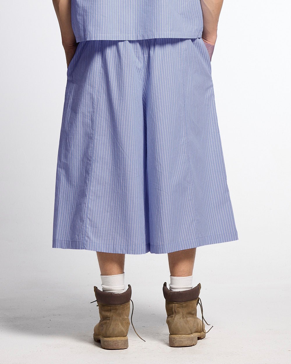 OFFICE SCRIPT SHORTS BLUE - blue striped wide leg shorts, back view on male model - Cold Culture