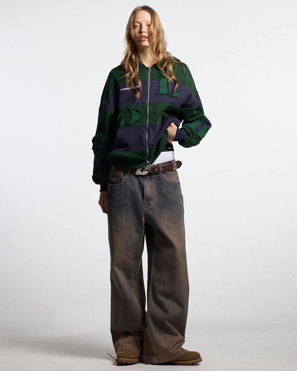PUZZLE ZIP HOODIE GREEN & NAVY - green and navy striped zip-up hoodie, front view on female model - Cold Culture #woman