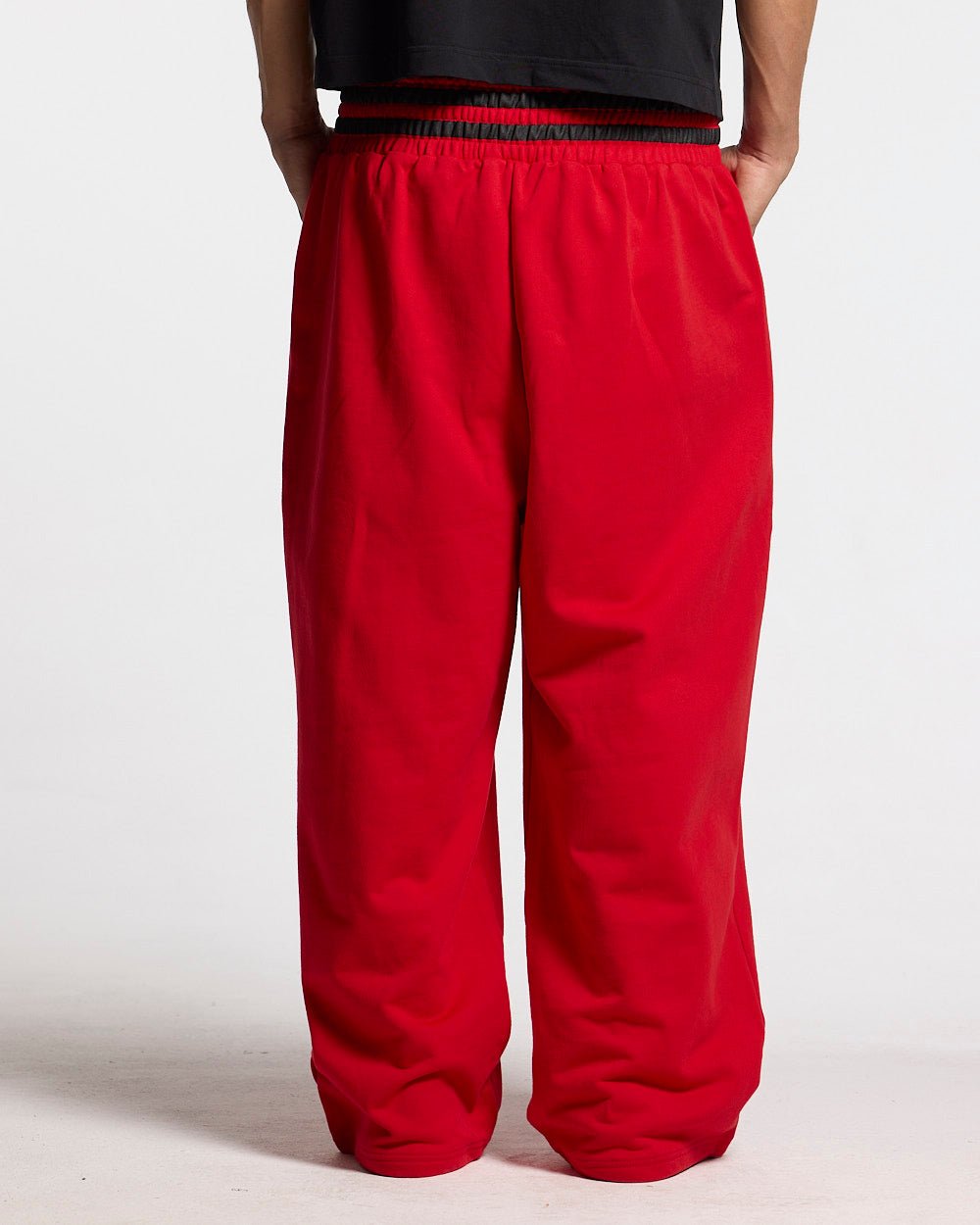 RAGE IN THE RING PANTS RED - red baggy sweatpants, back view on male model - Cold Culture