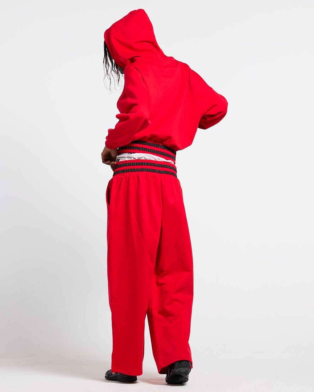 RAGE IN THE RING PANTS RED - red baggy sweatpants, back view on female model - Cold Culture #woman