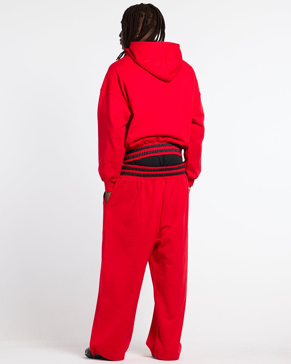 RAGE IN THE RING PANTS RED - red baggy sweatpants, back view on male model - Cold Culture